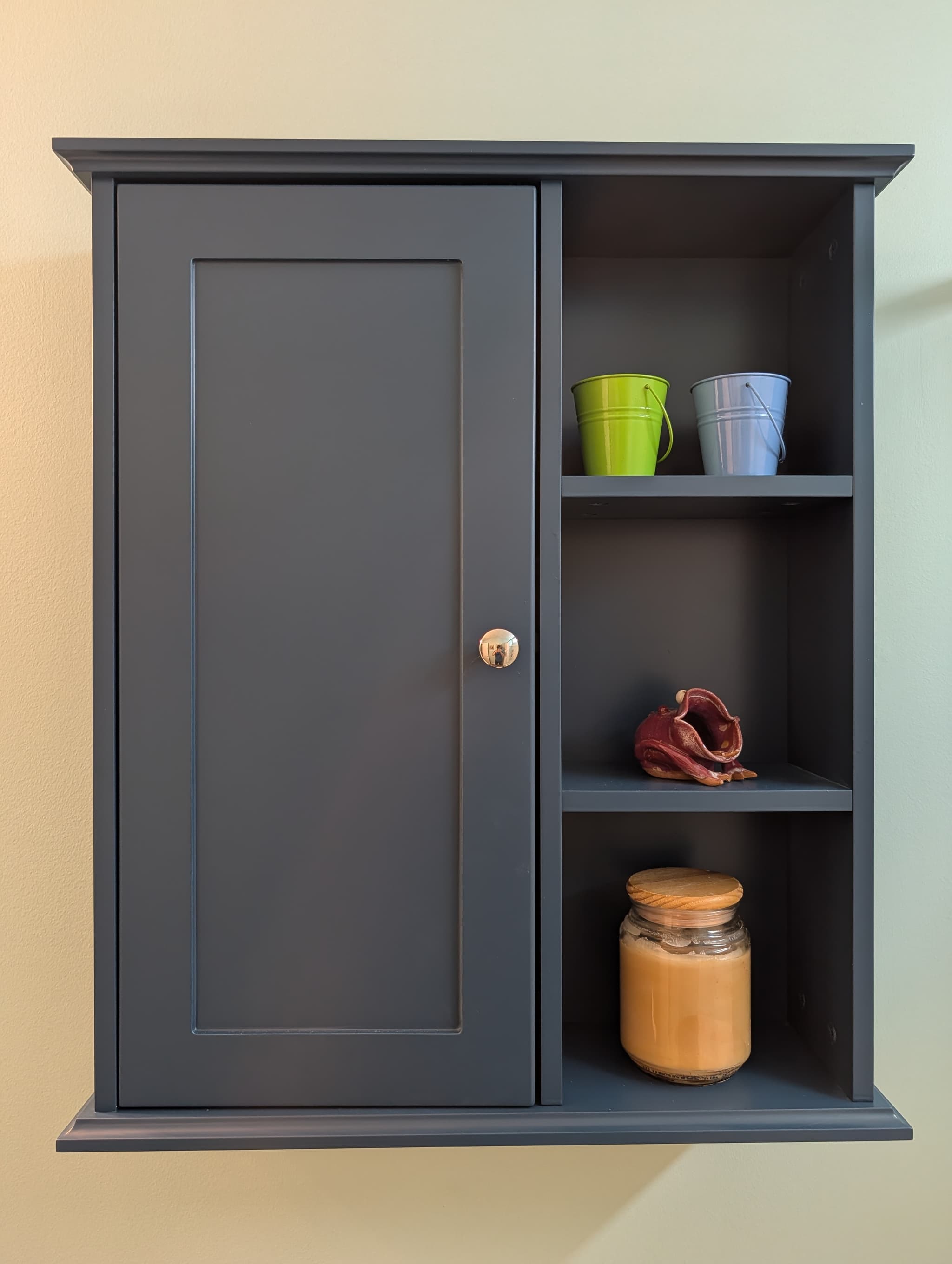 Bathroom wall storage cabinet refinished in navy by TruCare