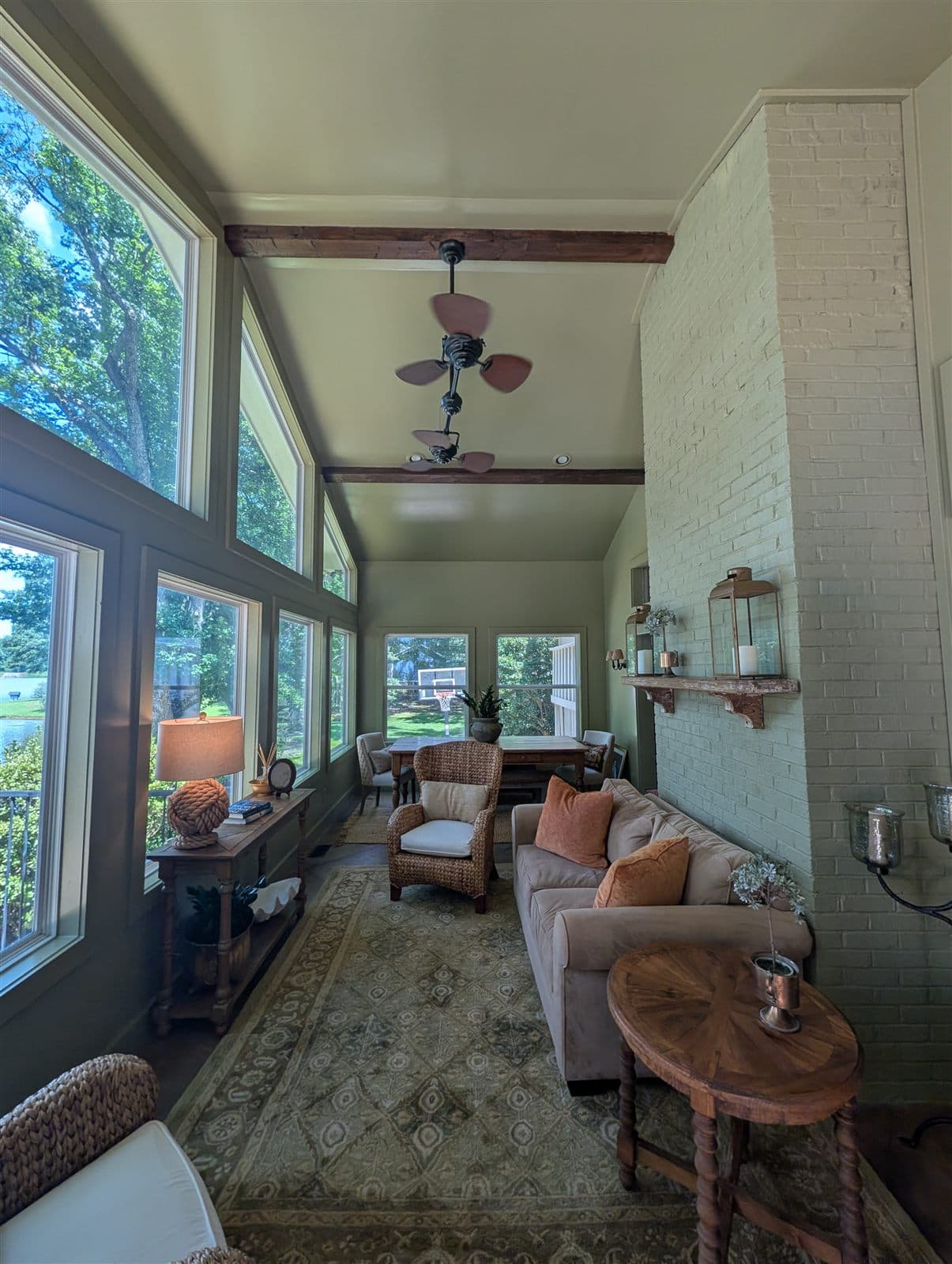 Color-drenched lake room with a wall of windows overlooking the water in Pelzer, SC